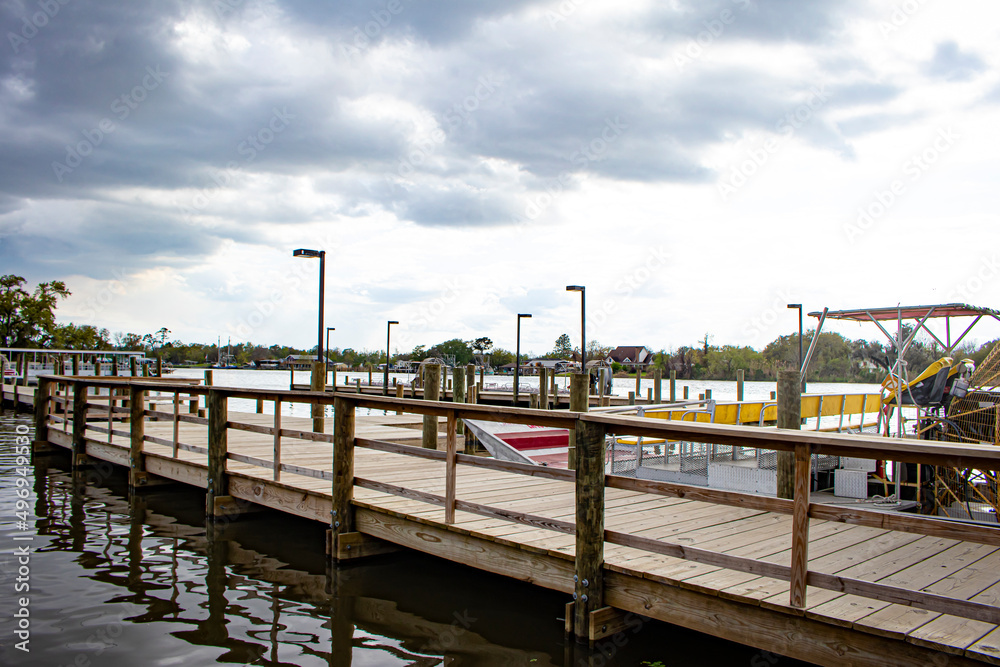 A Dock Extends into the Waterfront for Airboats to Park at in Lafitte, Louisiana, USA