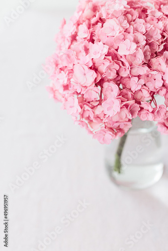 Fototapeta Naklejka Na Ścianę i Meble -  Beautiful pink hydrangea flowers in a vase on a table.