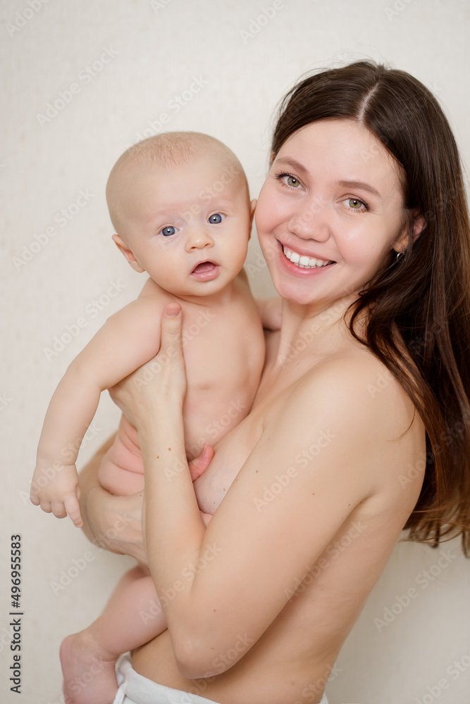 beautiful and gentle naked mom and baby against the wall beautiful and gentle naked mom and baby against the wall