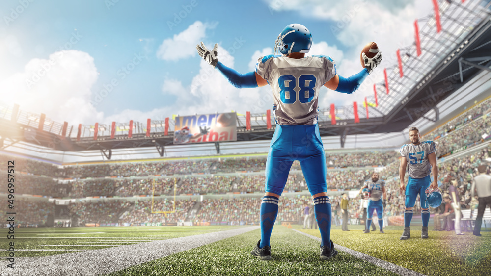 Joy in football. American football player celebrating victory at stadium during daytime. Sport emotions. Back view