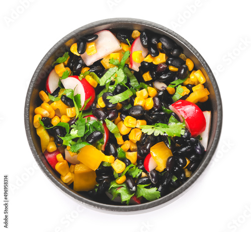 Bowl of Mexican vegetable salad with radish and black beans isolated on white background