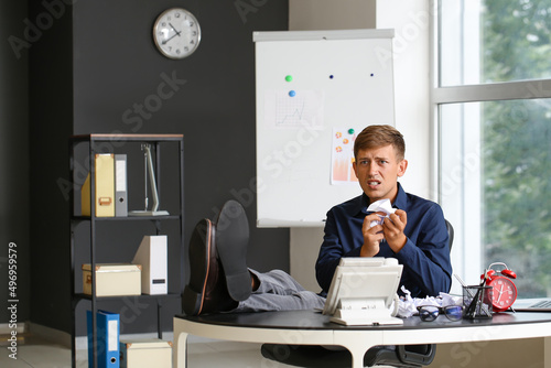 Displeased young businessma...