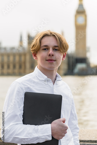 Photography travel, tourism, , leisure and people concept - happy man with laptop over londo