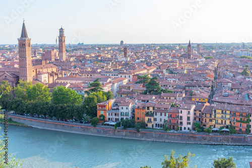 Sunset view of the italian city verona including church of saint anastasia and torre dei lamberti photo