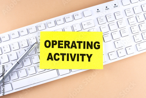 Text OPERATING ACTIVITY text on a sticky on keyboard, business concept photo