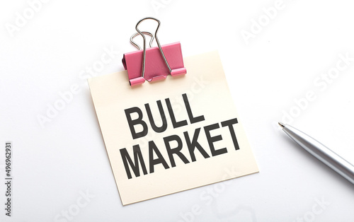 BULL MARKET text on sticker with pen on the white background