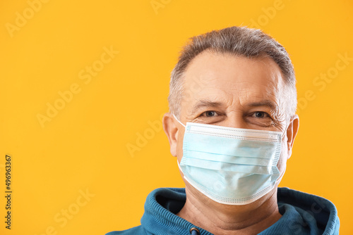 Senior man in medical mask ...