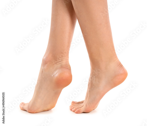 Female bare feet on white background, closeup © Pixel-Shot