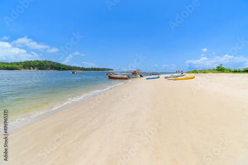 Landscape of Praia dos Carneiros, a famous beach of Tamandare, PE, Brazil. View to the tourist boats and kayaks on the sand. Tourist destination of people who visits Porto de Galinhas.