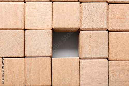 Texture made of many wooden cubes with one missing block in center