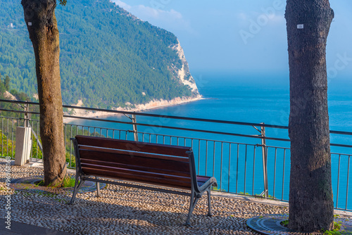 Bench overlooking Monte Conero park in Italy photo