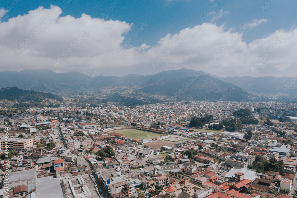 San Marcos Guatemala - Aerial shot of the small city surrounded by mountains - Stadium in a Latin American city