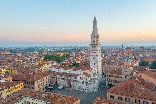 Sunrise view of the Cathedral of Modena and Ghirlandina tower in Italy photo
