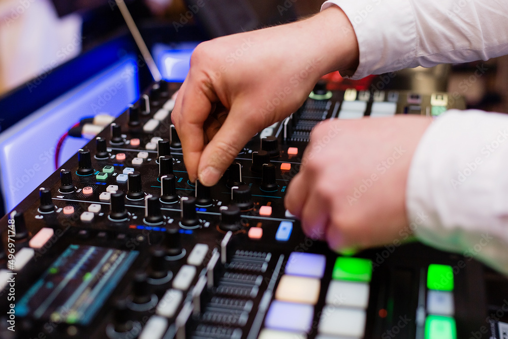 Hand of a deejay playing music