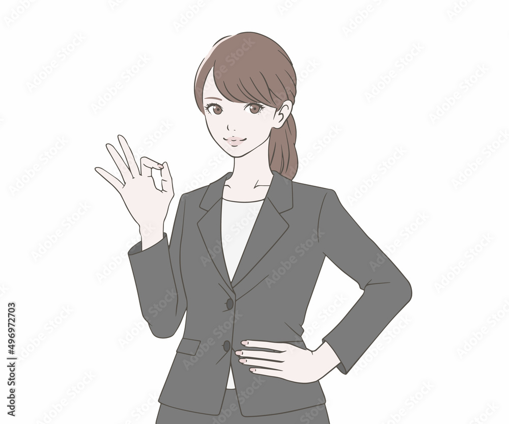 OKマークをつくるスーツを着た女性