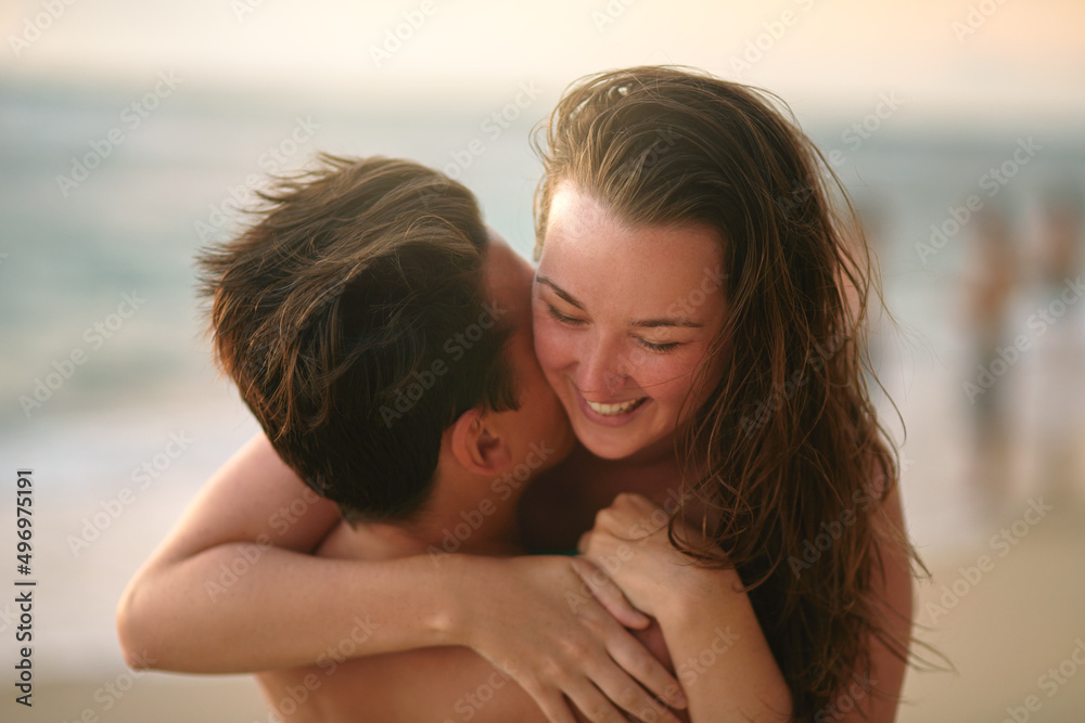 Enjoying some quality time at the beach. Cropped shot of an affectionate young couple enjoying the day at the beach. Enjoying some quality time at the beach. Cropped shot of an affectionate young couple enjoying the day at the beach.