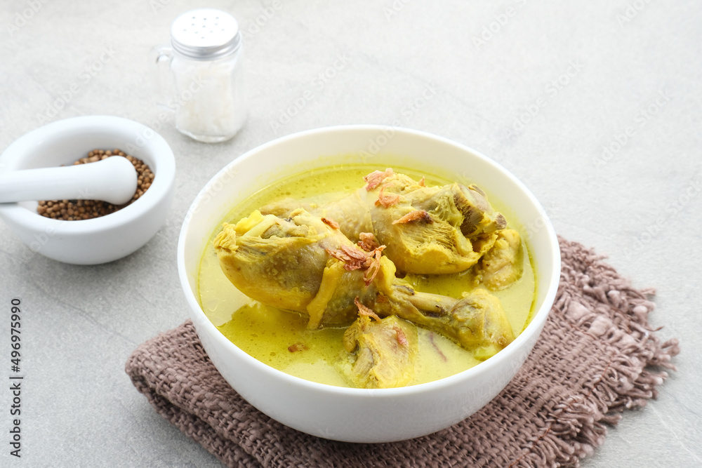 Opor Ayam, Indonesian traditional food. Opor made from chicken cooked with coconut milk and spices. Its served to celebrate Eid Adha and Eid Fitr. Selective focus.
Opor Ayam, Indonesian traditional food. Opor made from chicken cooked with coconut milk and spices. Its served to celebrate Eid Adha and Eid Fitr. Selective focus.