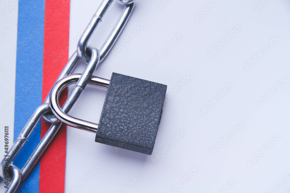 Flag of Russia and a chain with a lock. Country blocking. Prohibited. Flag of Russia and a chain with a lock. Country blocking. Prohibited.