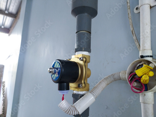 Solenoid Valve installed on the water pressure pipe line. photo