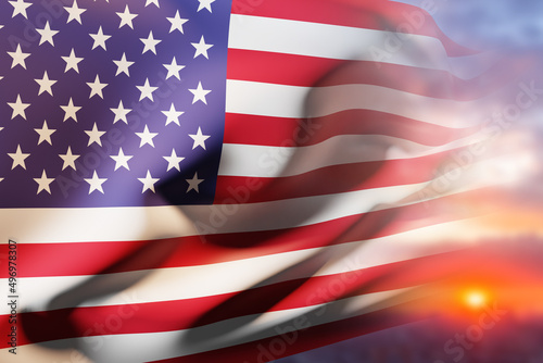 American flag and ray of sunshine. Waving American flag on the background of the sunrise. Star-spangled banner. Official banner of America. Symbol of the USA. 3d image