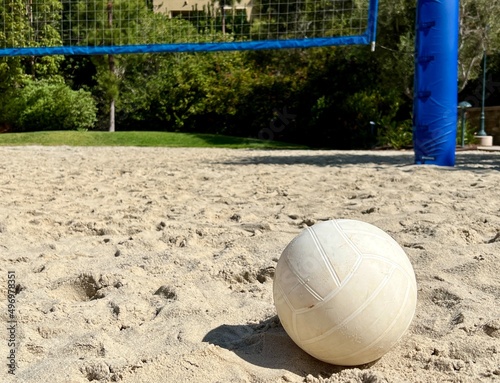 White beach volleyball on a sand volleyball court at a resort