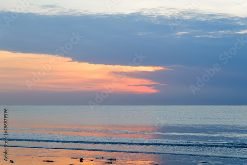 Beautiful beach and tropical sea, Wave of the sea on the sand beach and Nature background.soft and blur focus. Close up of Fantastic silhouette sea view in tropical sunset.	

