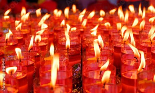 Burning candles at a Buddhist temple.