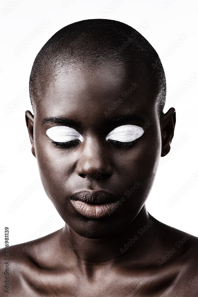 Beauty is simply black and white. Shot of a beautiful woman posing against a white studio background.