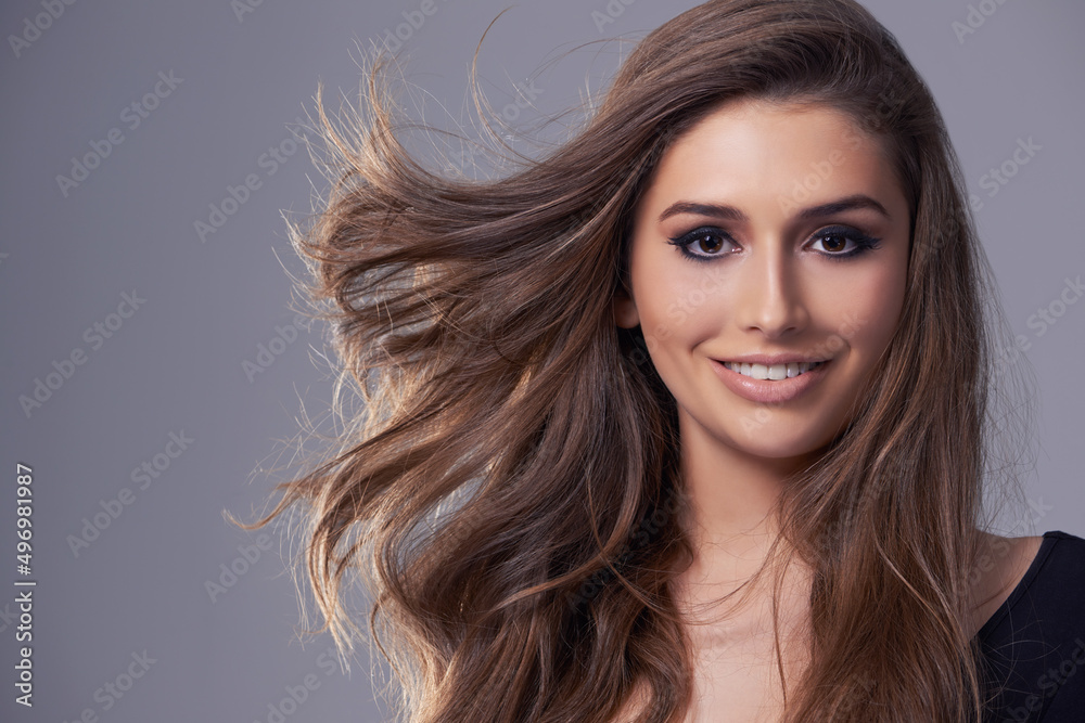 Enjoying life with a smile. Studio portrait of a gorgeous young woman.