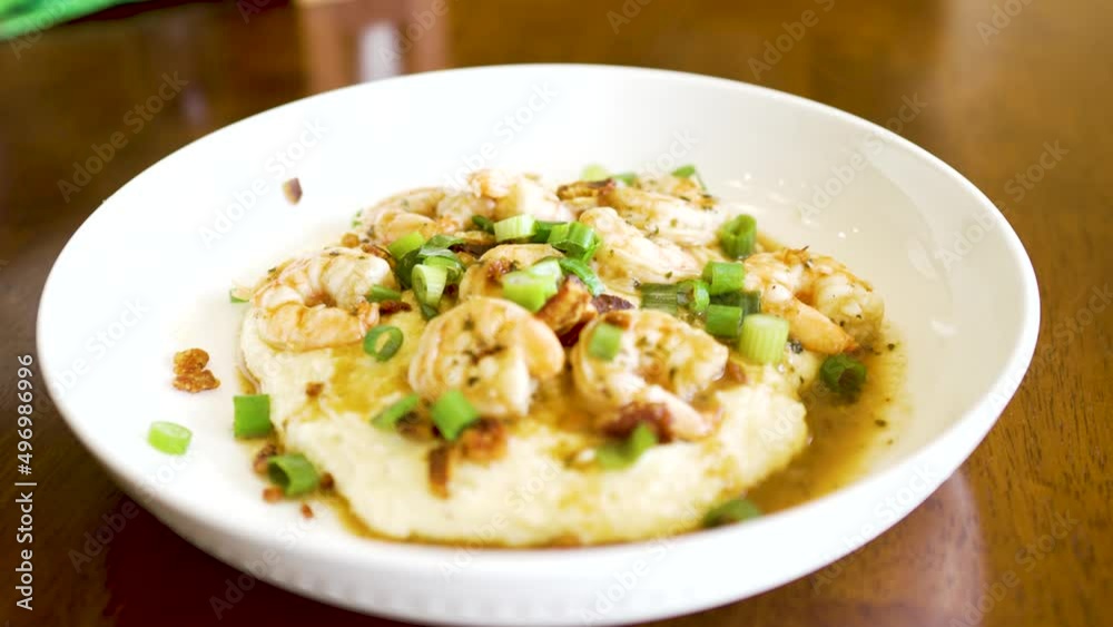 A plate of shrimp and grits steaming fresh and ready to eat A plate of shrimp and grits steaming fresh and ready to eat