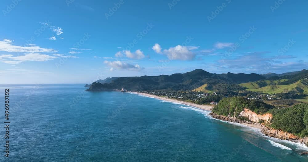 Flight descending towards Whiritoa Beach over turquoise tranquil sea - NZ Flight descending towards Whiritoa Beach over turquoise tranquil sea - NZ