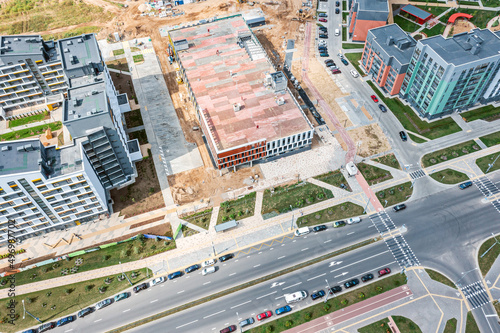 aerial view of residential district. new multilevel parking garage under construction.