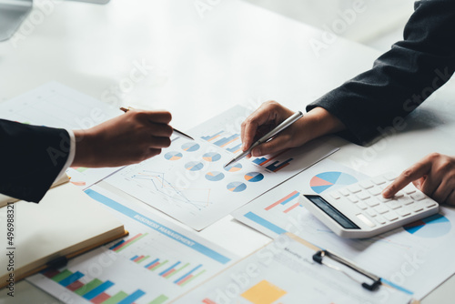 Business team analyzing income charts and graphs with modern laptop computer. Close up.Business analysis and strategy concept.