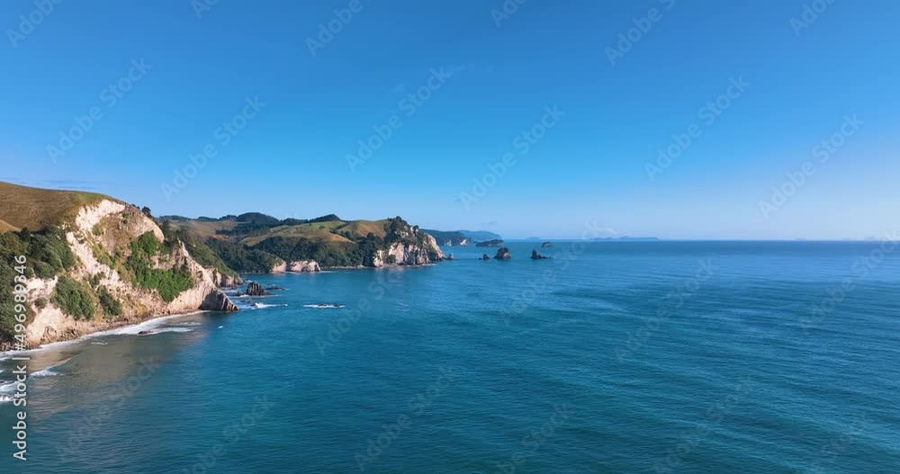 Flight across the calm seas and cliffsides of Coromandel's Papakura Bay -NZ Flight across the calm seas and cliffsides of Coromandel's Papakura Bay -NZ