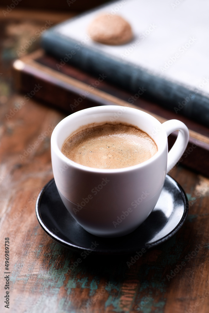 Cup of coffee on rustic wooden background. Close up. Cup of coffee on rustic wooden background. Close up.