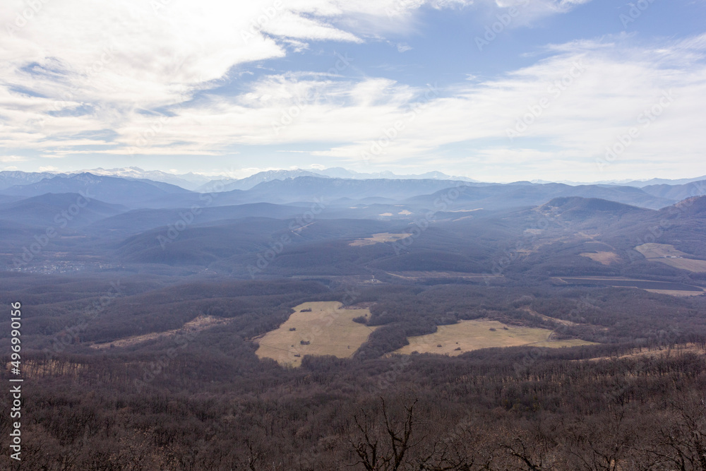 Winter mountain landscape on a sunny day, without snow cover, on observation decks.