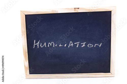 Foto The term humiliation written on a chalkboard