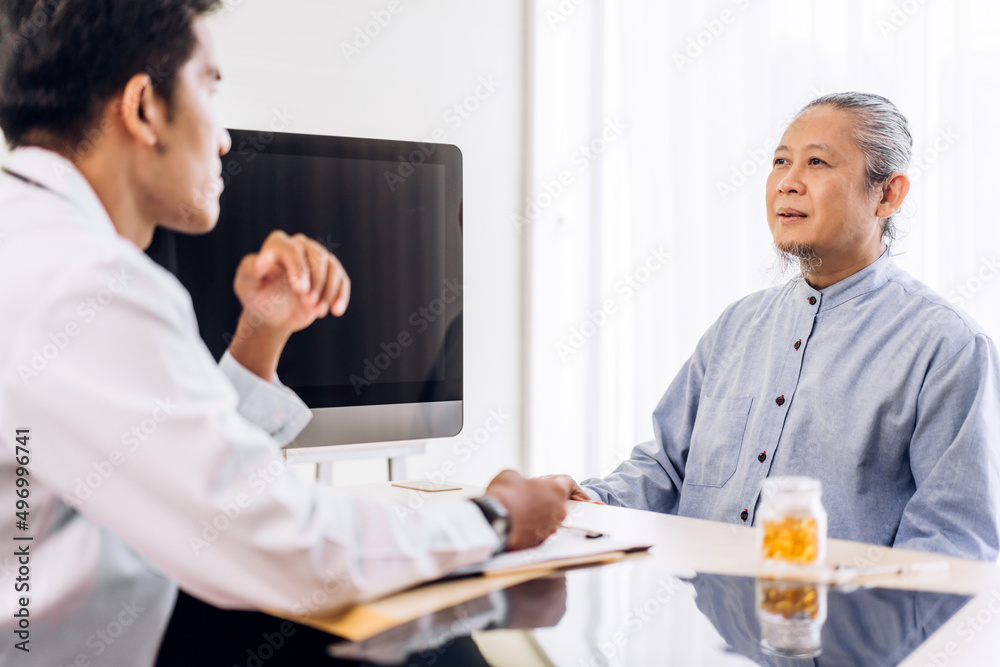 Asian man doctor service help support discussing and consulting talk to asian sick senior man patient at meeting health medical care trust concept in hospital.healthcare and medicine Asian man doctor service help support discussing and consulting talk to asian sick senior man patient at meeting health medical care trust concept in hospital.healthcare and medicine