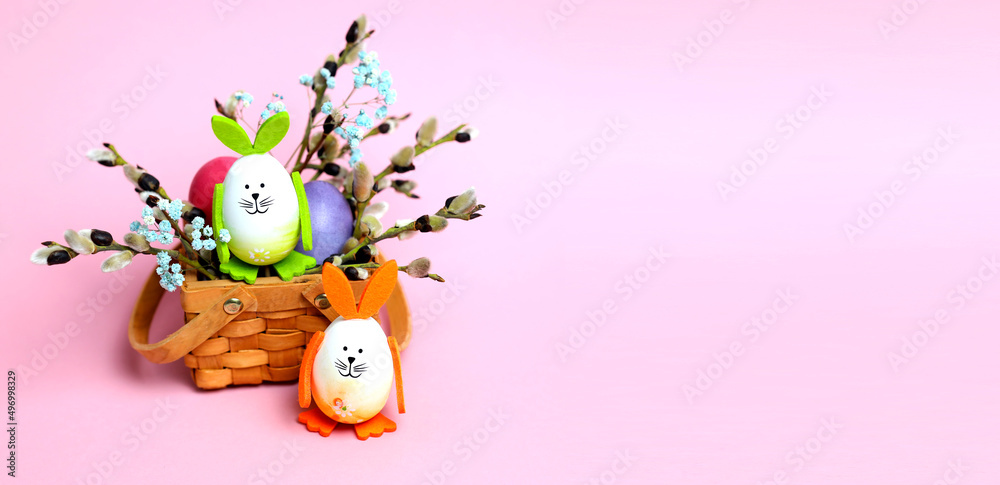 Fototapeta premium Easter eggs are decorated with bunny ears and look like bunny. For print, Easter card, banner, place for text. with copy space. invitation card, poster