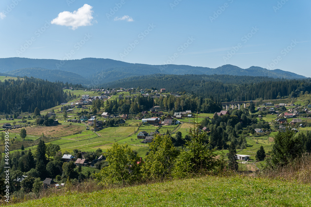 A beautiful landscape of a small village in the mountains in the summer