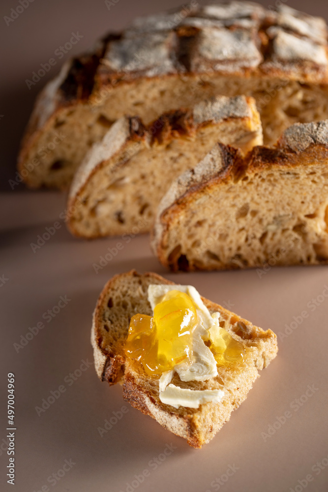 A loaf of bread on the table, sliced bread. High quality photo