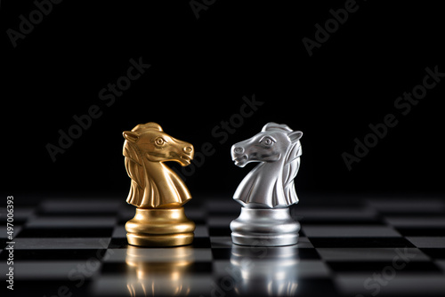Chess knight on chessboad competition and strategy concept