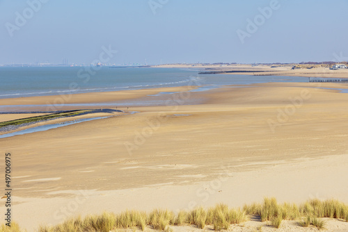 Beaches at the mouth of the Scheldt with the contours of Vlissingen in a far distance