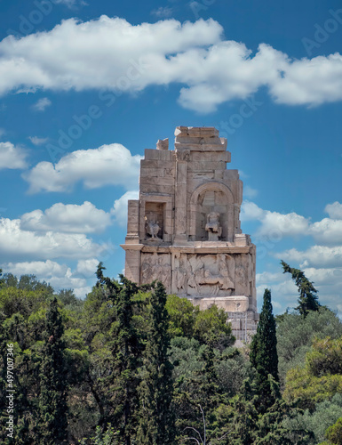 Philopappou monument hill under a blue sky with some clouds, Athens, Greece