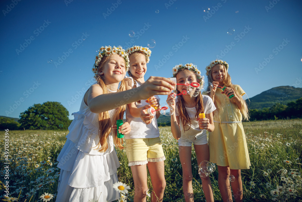 Fototapeta premium Children play in nature. Cheerful rest. High quality photo