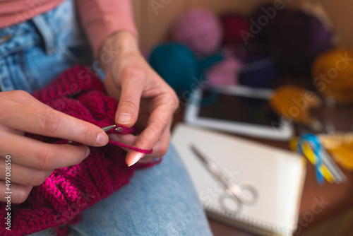 woman is knitting  female hands close-up