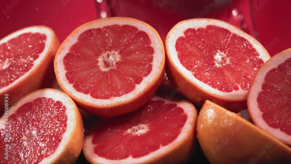 Slow Motion Shot of Grapefruit Water Splashing through Grapefruit Slices Slow Motion Shot of Grapefruit Water Splashing through Grapefruit Slices