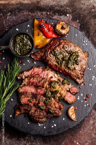 Top view of delicious grilled beef steak and vegetables served