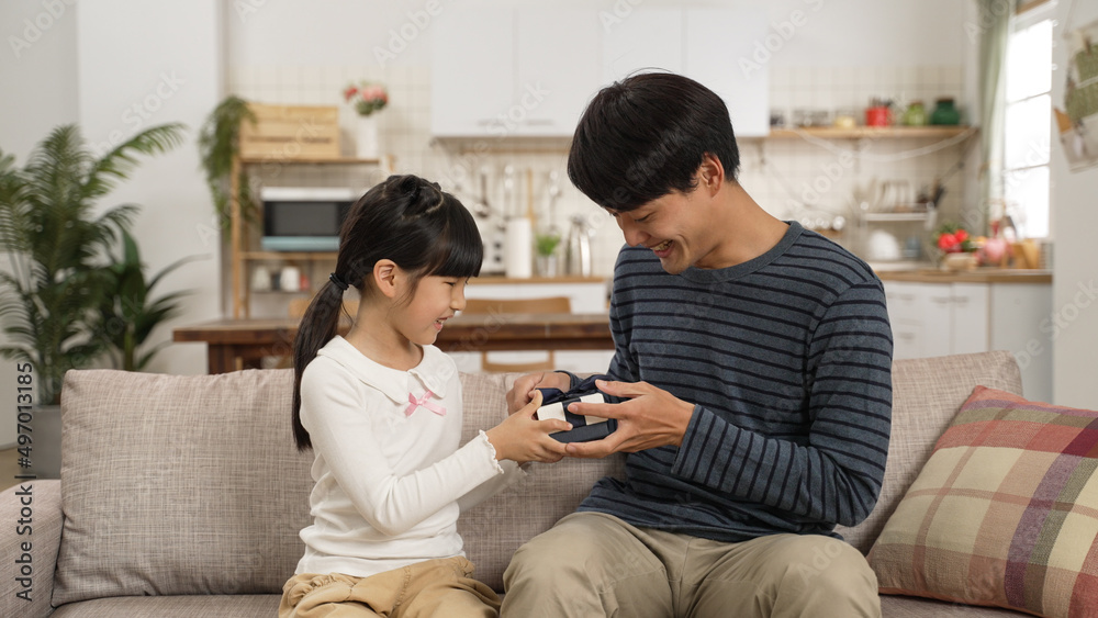 happy asian dad feel surprised after releasing hand covering face and seeing the father’s day gift in the living room at home happy asian dad feel surprised after releasing hand covering face and seeing the father’s day gift in the living room at home