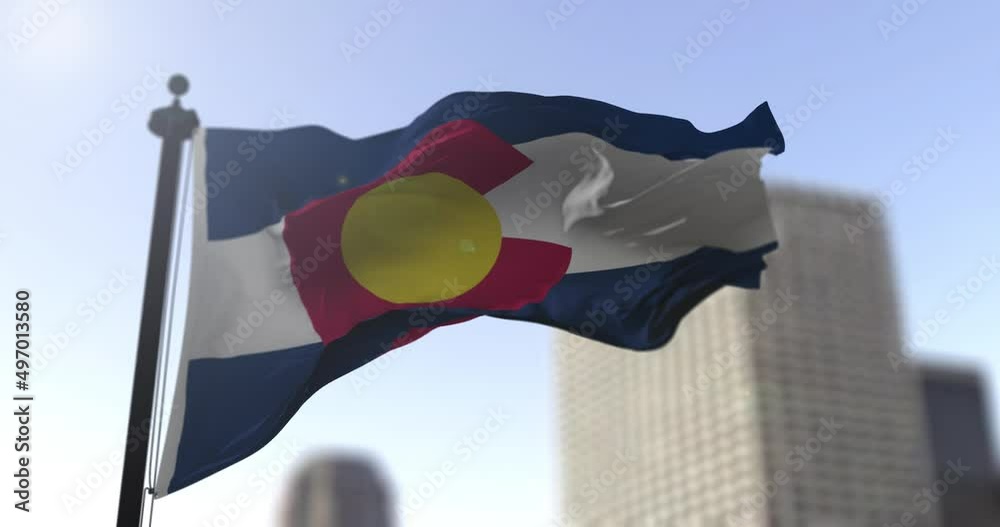 Colorado state waving flag on blurry background, USA state news illustration. Blurry background